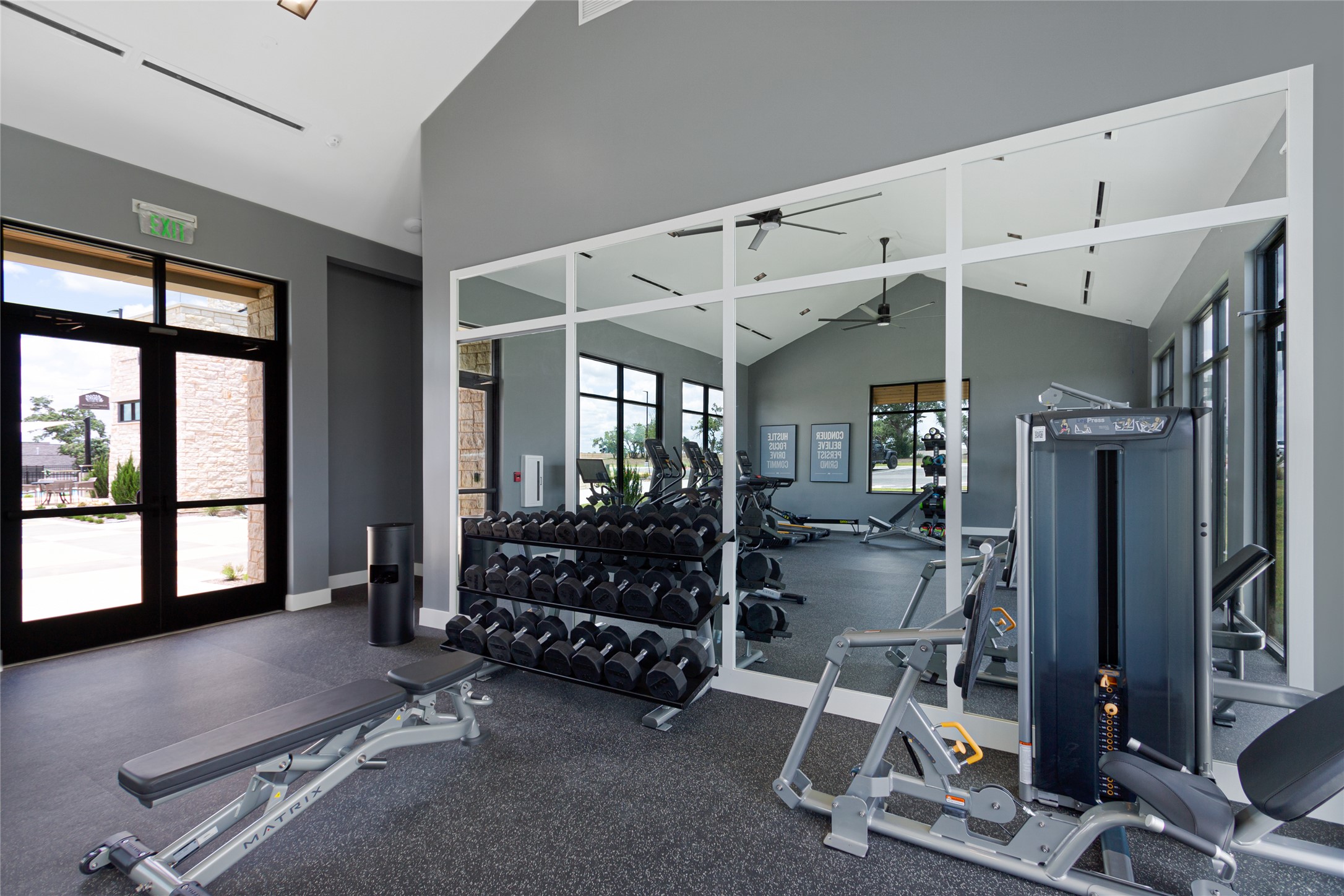 248 Prickly Poppy Way Georgetown, TX 78633 - Photo 8 of 26 Fitness facility with ample natural light, vaulted ceilings, and a variety of workout equipment.