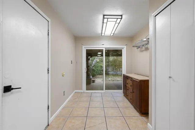 a bathroom with a glass door shower and a sink
