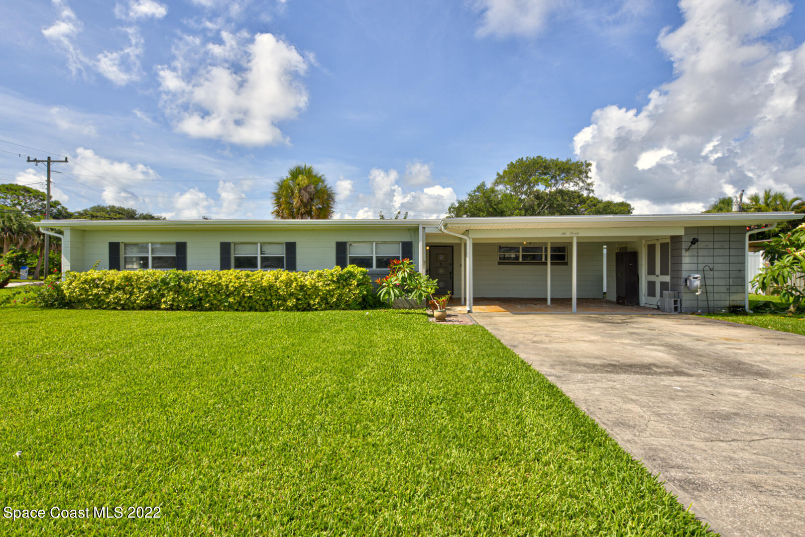 620 Java Road Cocoa Beach, FL 32931 - Photo 1 of 39 a front view of a house with garden