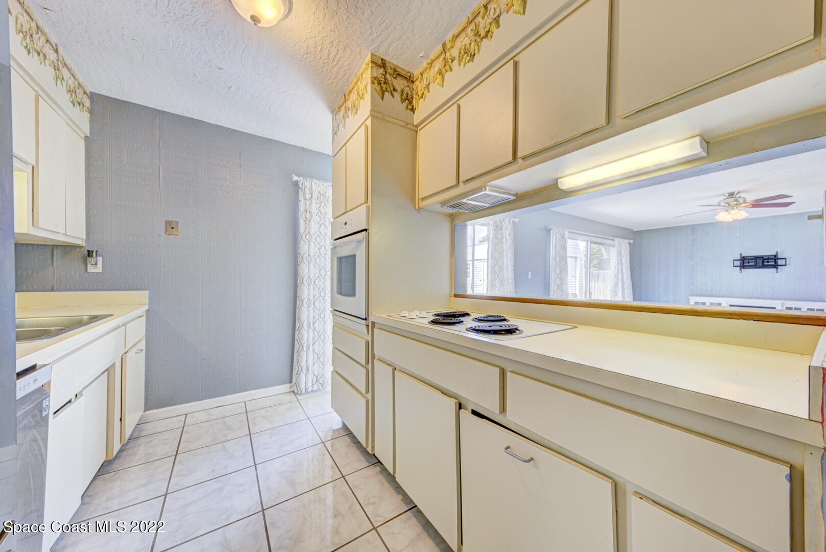 620 Java Road Cocoa Beach, FL 32931 - Photo 12 of 39 a kitchen with a stove and a sink