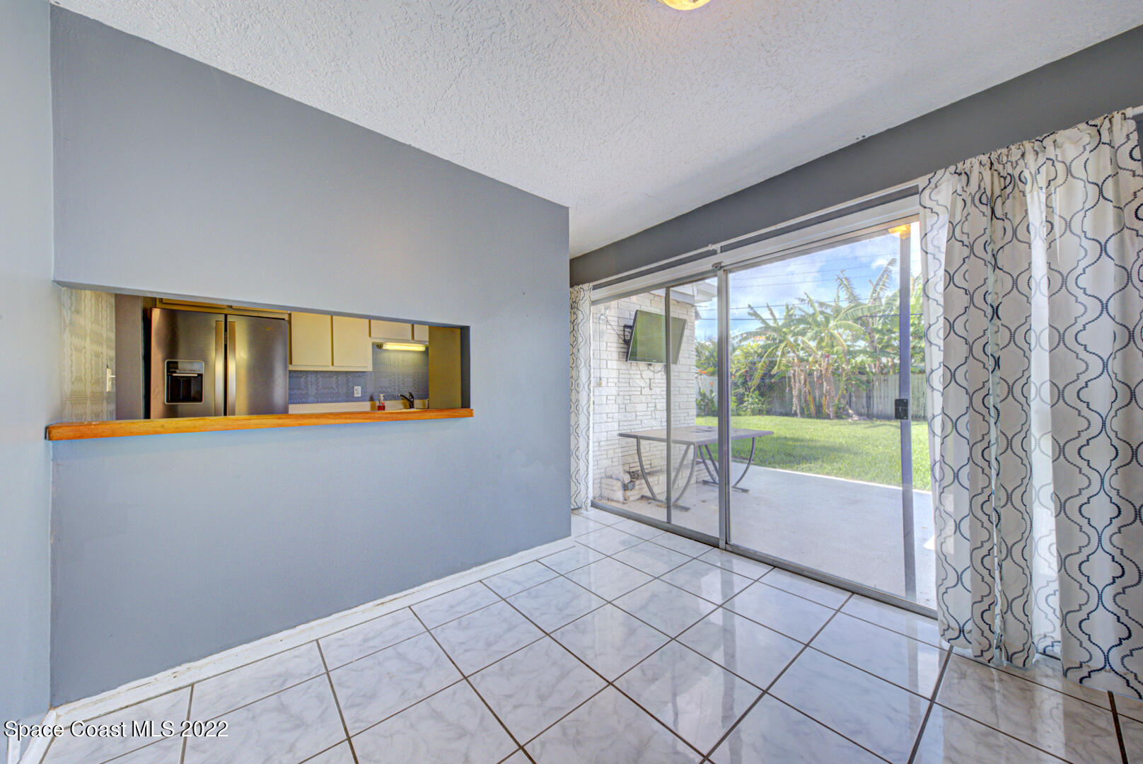 620 Java Road Cocoa Beach, FL 32931 - Photo 15 of 39 dining room with slider to backyard