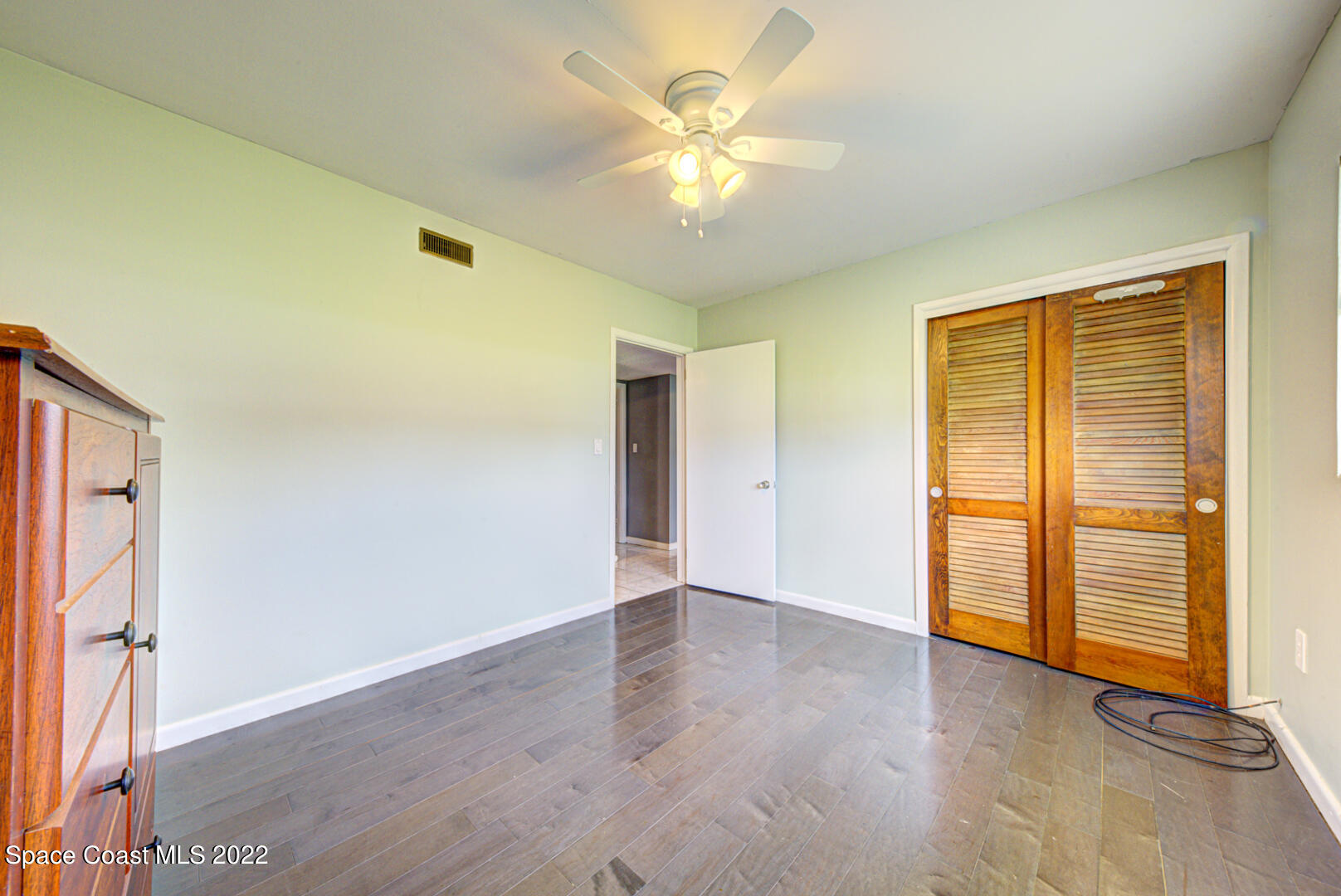 620 Java Road Cocoa Beach, FL 32931 - Photo 24 of 39 wooden floor in an empty room with a window