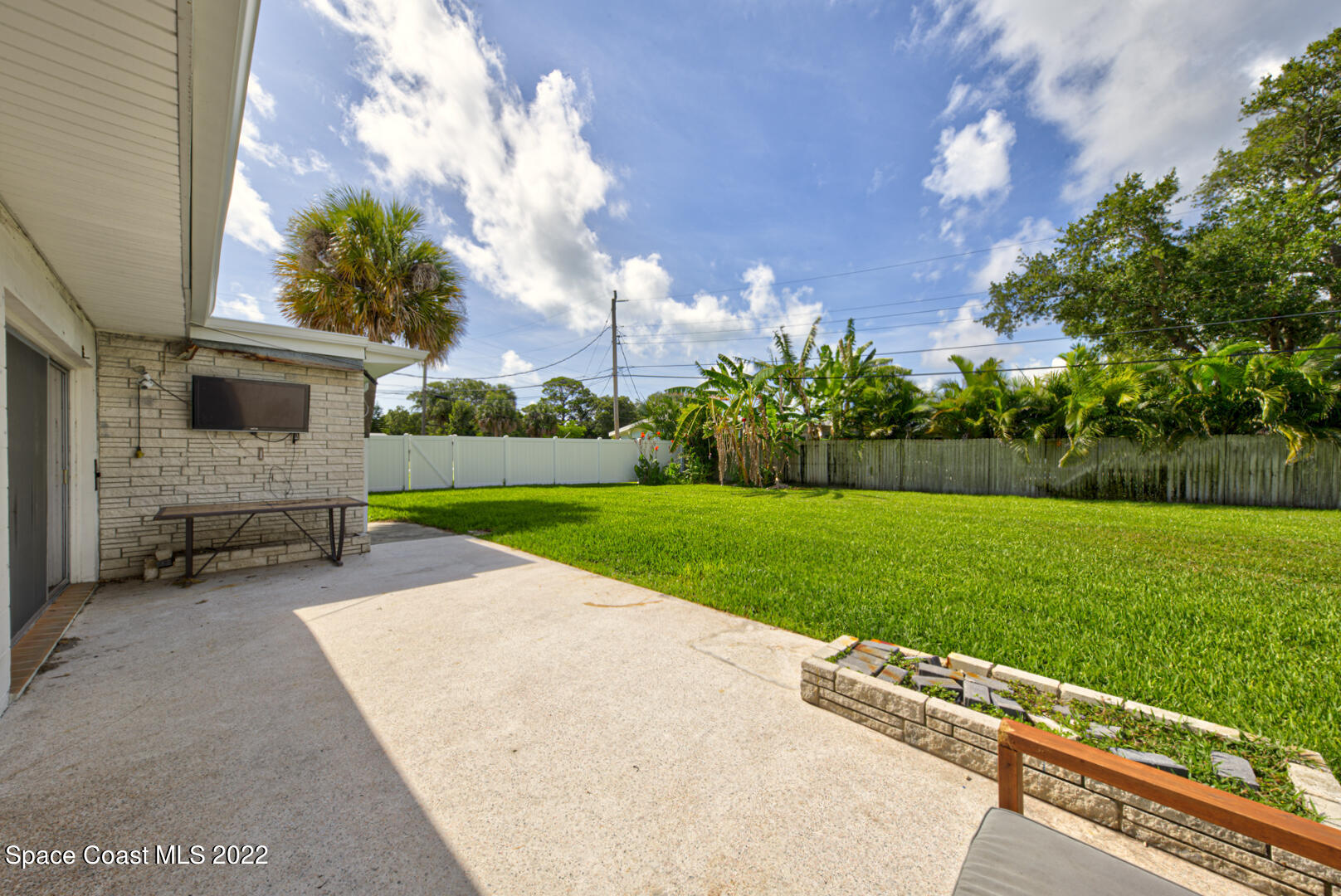 620 Java Road Cocoa Beach, FL 32931 - Photo 30 of 39 a view of backyard with barbeque grill and a garden
