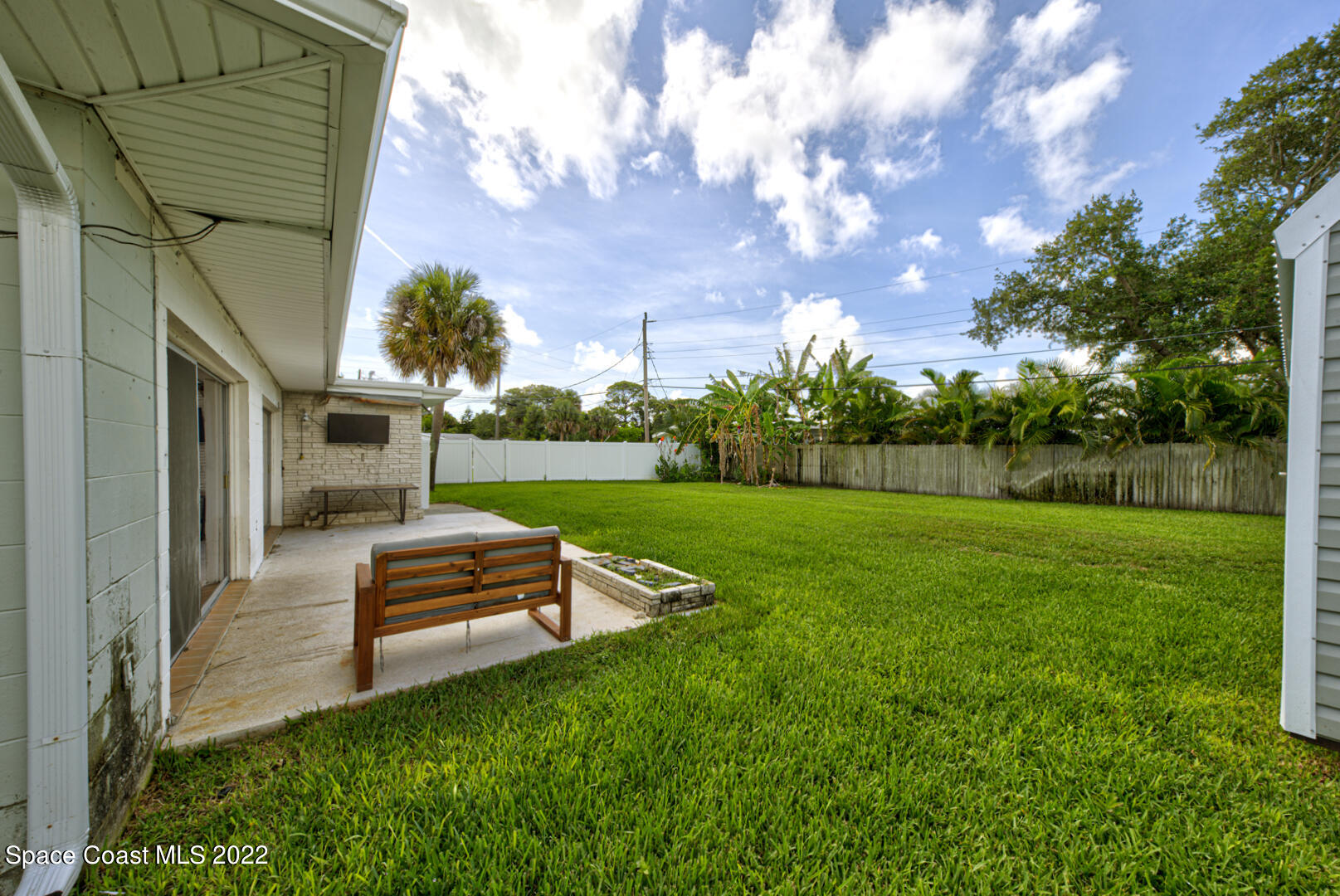 620 Java Road Cocoa Beach, FL 32931 - Photo 33 of 39 a view of backyard with seating area and green space