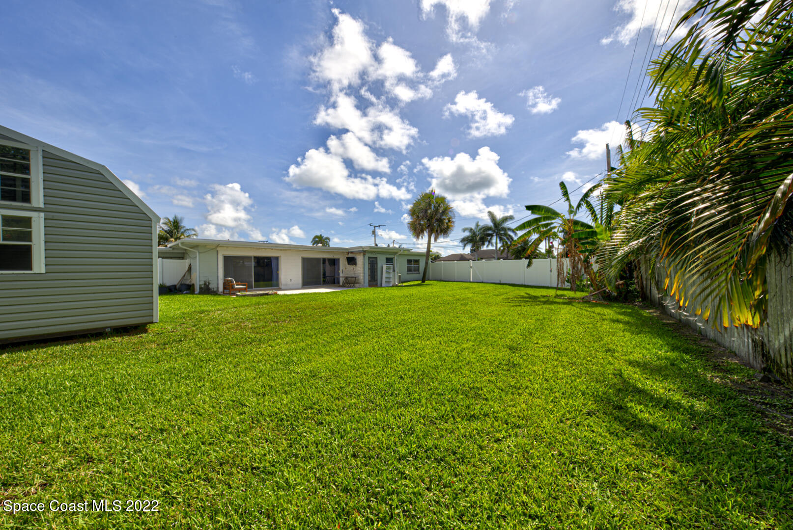620 Java Road Cocoa Beach, FL 32931 - Photo 35 of 39 a front view of a house with a garden