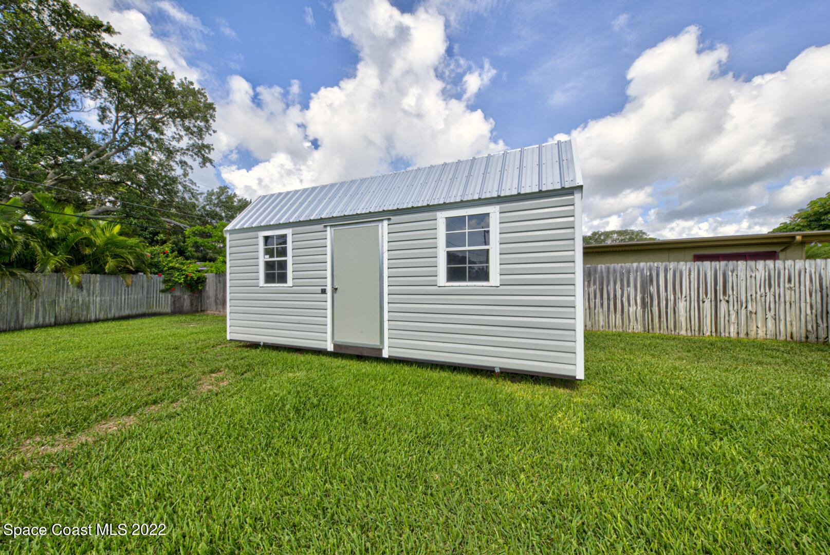 620 Java Road Cocoa Beach, FL 32931 - Photo 36 of 39 a view of a backyard with a garden
