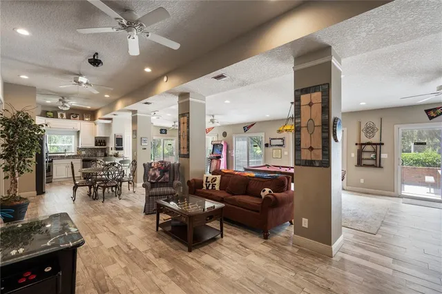 a kitchen with stainless steel appliances a stove refrigerator sink and microwave