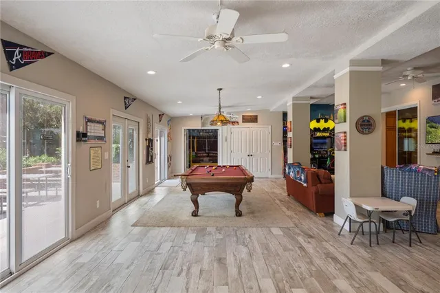 a bathroom with a granite countertop toilet sink and mirror