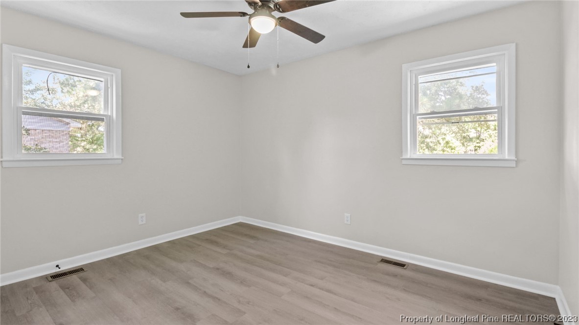 3610 Yorktown Road Hope Mills, NC 28348 - Photo 15 of 22 an empty room with a window and wooden floor