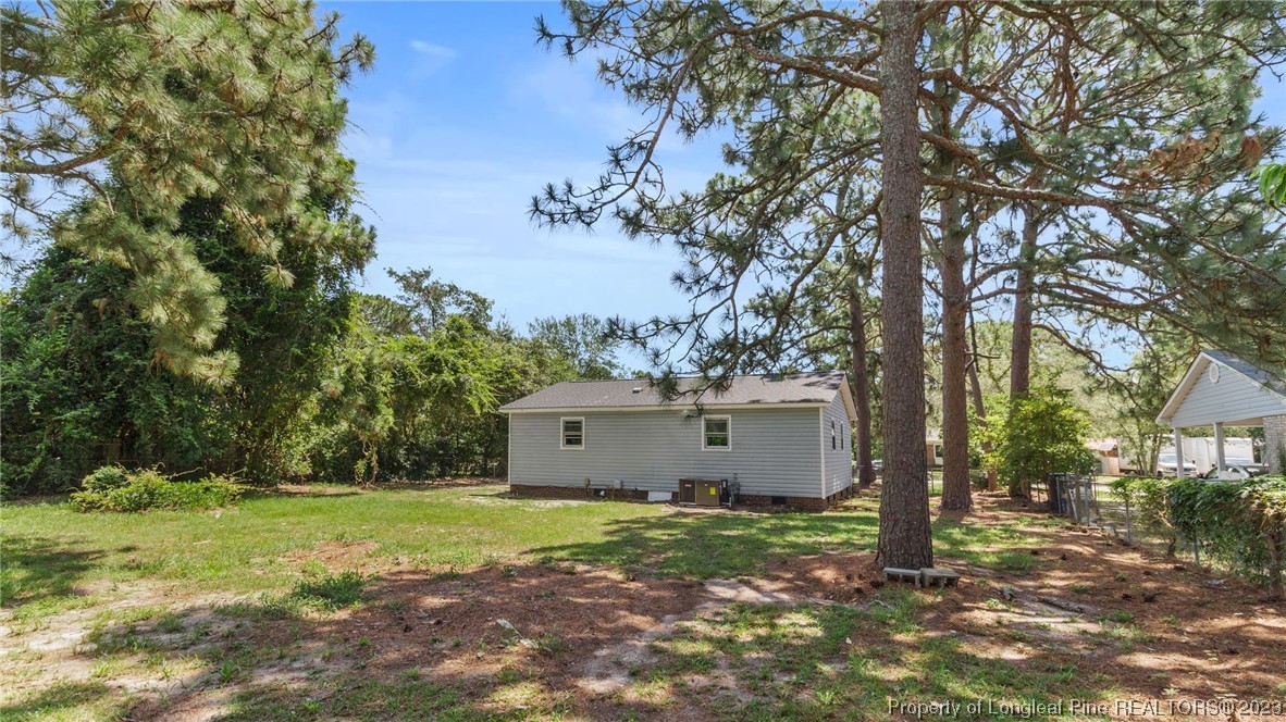 3610 Yorktown Road Hope Mills, NC 28348 - Photo 20 of 22 a view of a house with yard and a tree