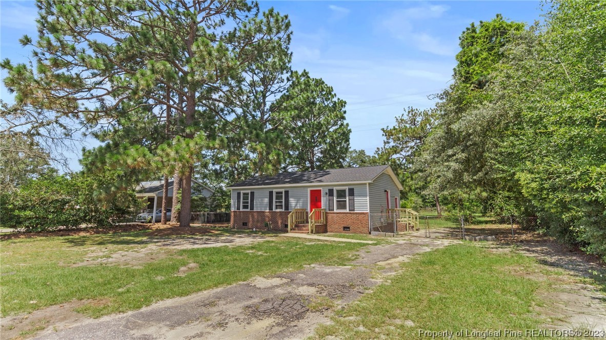 3610 Yorktown Road Hope Mills, NC 28348 - Photo 2 of 22 a view of house with yard and outdoor space