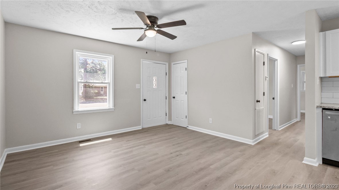 3610 Yorktown Road Hope Mills, NC 28348 - Photo 5 of 22 wooden floor in an empty room with a window