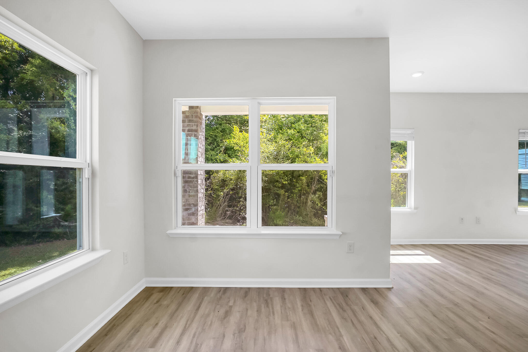 34 Sandywoods Court Freeport, FL 32439 - Photo 12 of 41 a view of an empty room with wooden floor and a window