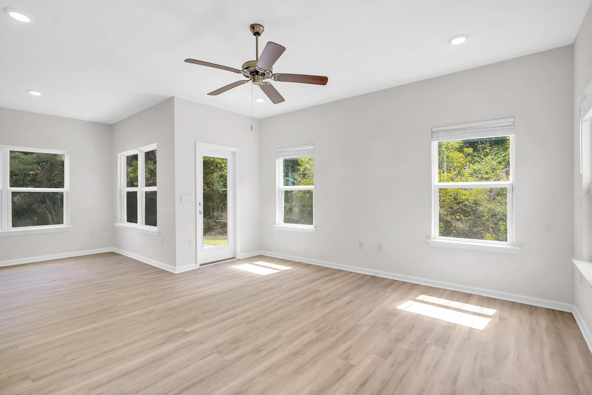 34 Sandywoods Court Freeport, FL 32439 - Photo 13 of 41 a view of an empty room with wooden floor and a window