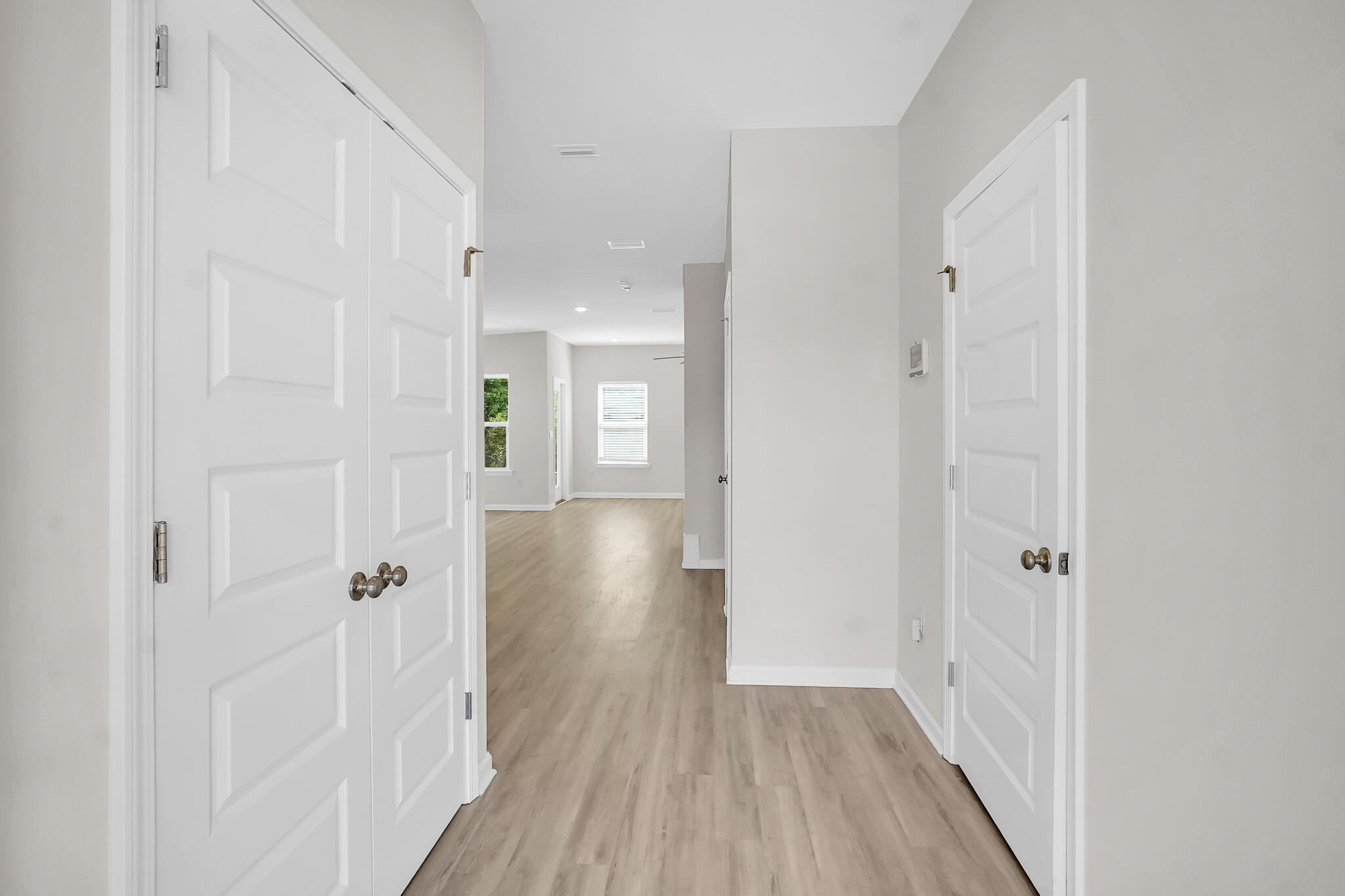 34 Sandywoods Court Freeport, FL 32439 - Photo 3 of 41 a view of a hallway with wooden floor