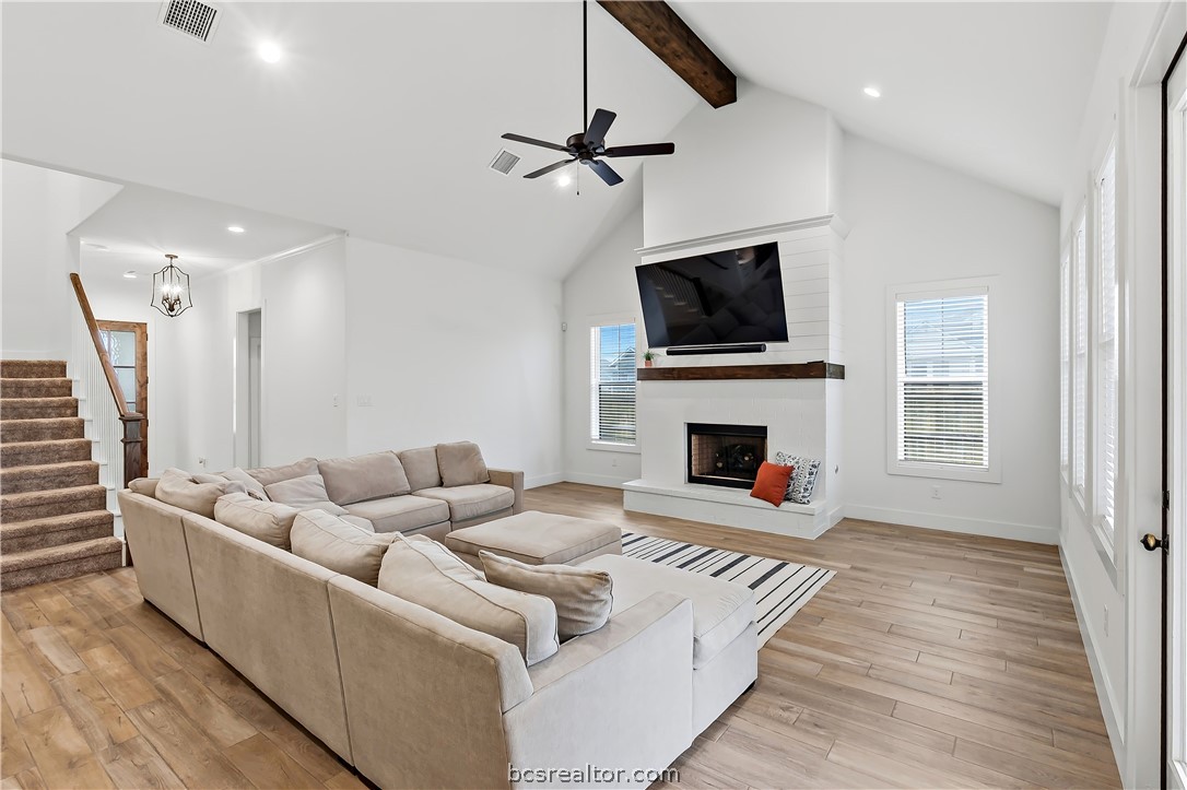 3512 Castine Court Bryan, TX 77808 - Photo 11 of 45 Beautiful bright room with vaulted ceiling, gas fireplace with logs & upgraded shiplap