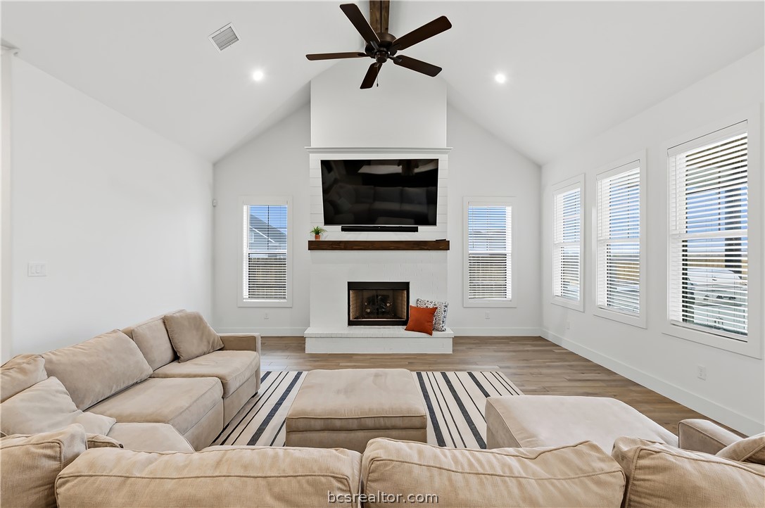 3512 Castine Court Bryan, TX 77808 - Photo 12 of 45 Beautiful bright room with vaulted ceiling, gas fireplace with logs & upgraded shiplap