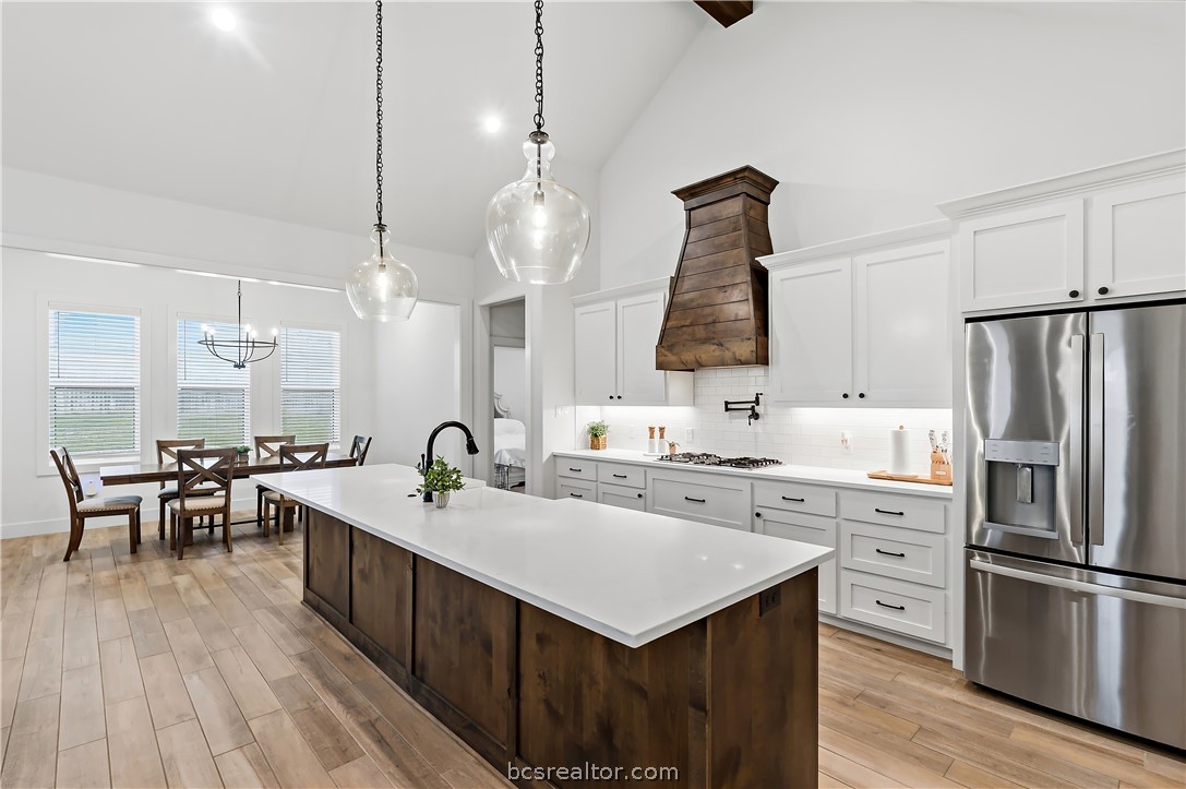 3512 Castine Court Bryan, TX 77808 - Photo 15 of 45 Chefs Kitchen with pot filler, large island with eating bar & large walk in pantry