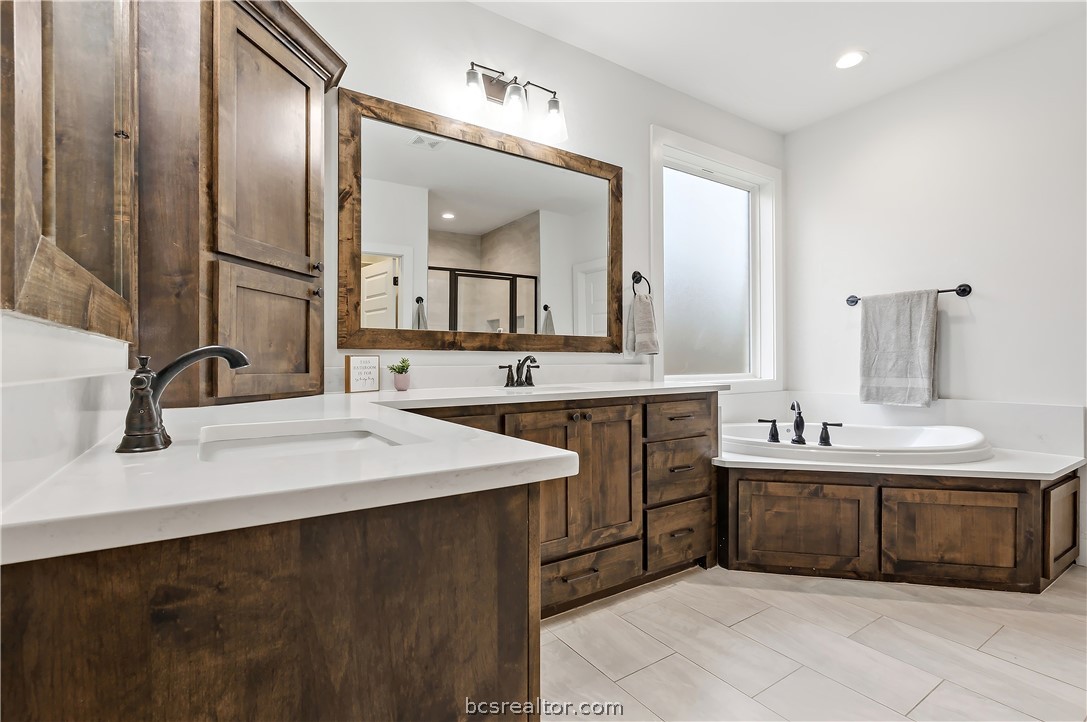3512 Castine Court Bryan, TX 77808 - Photo 24 of 45 Custom cabinets, ample counter space & garden tub