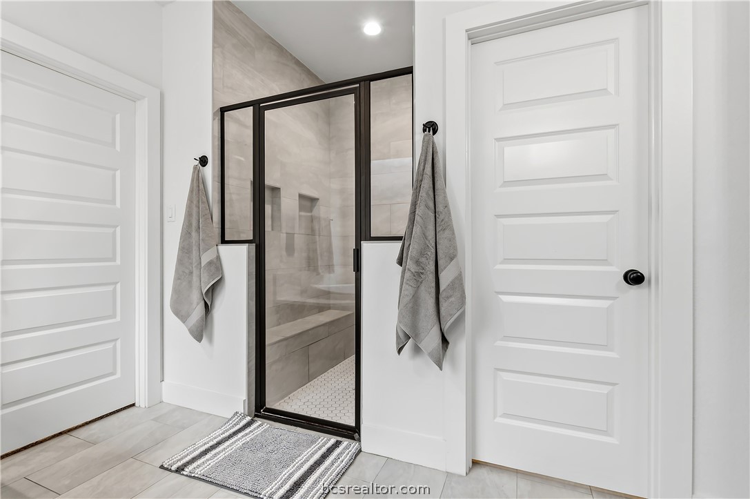 3512 Castine Court Bryan, TX 77808 - Photo 27 of 45 Walk in tile shower with bench