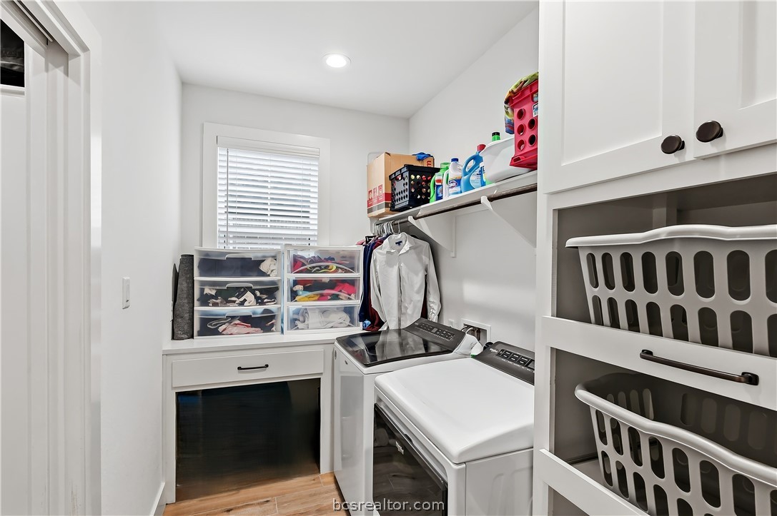 3512 Castine Court Bryan, TX 77808 - Photo 40 of 45 Laundry room with upgraded pull out laundry basket storage and counterspace