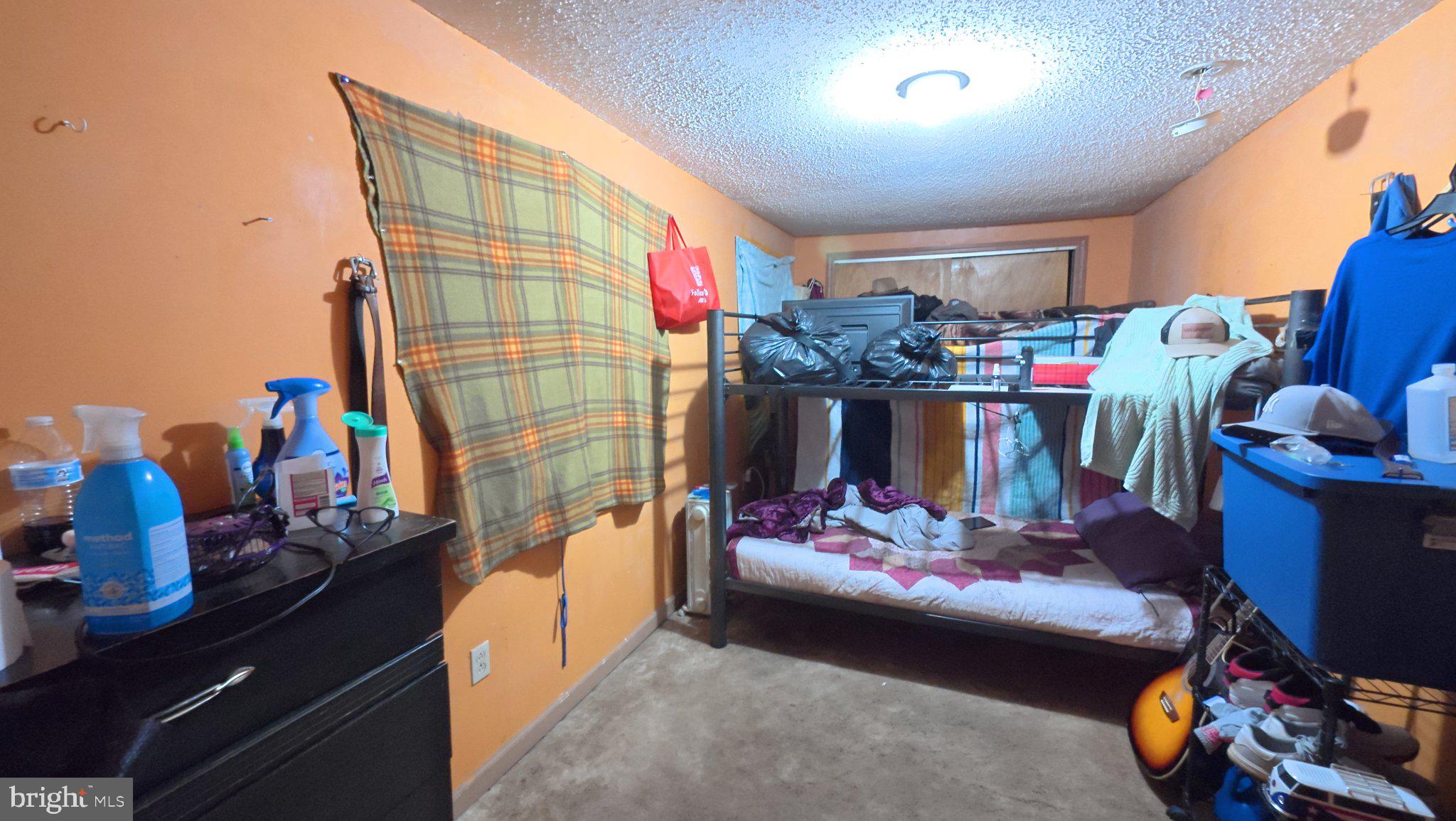 458 North Burlington Road Bridgeton, NJ 08302 - Photo 4 of 9 Cozy room with vibrant orange walls.