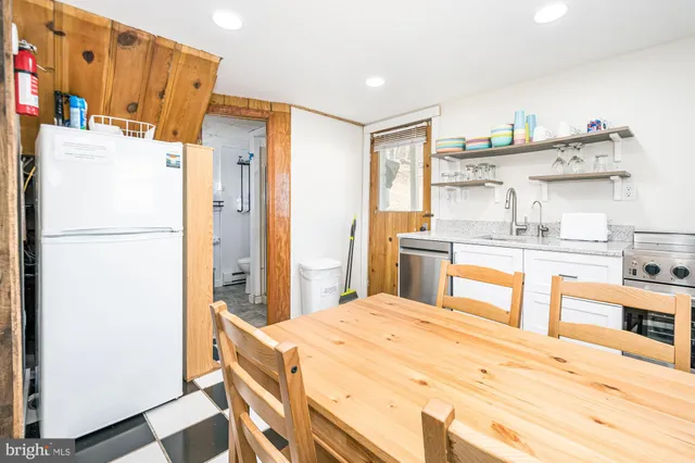 a kitchen with stainless steel appliances a refrigerator and a stove