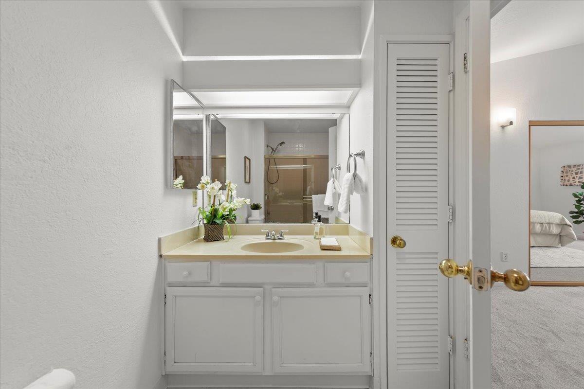 2392 North Main Street, Unit E Salinas, CA 93906 - Photo 20 of 27 a bathroom with a sink and a mirror
