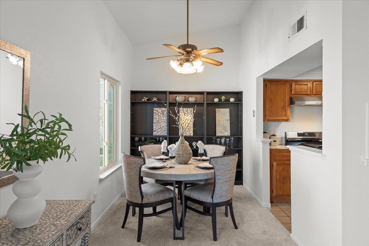 2392 North Main Street, Unit E Salinas, CA 93906 - Photo 6 of 27 a dining room with furniture potted plants and wooden floor