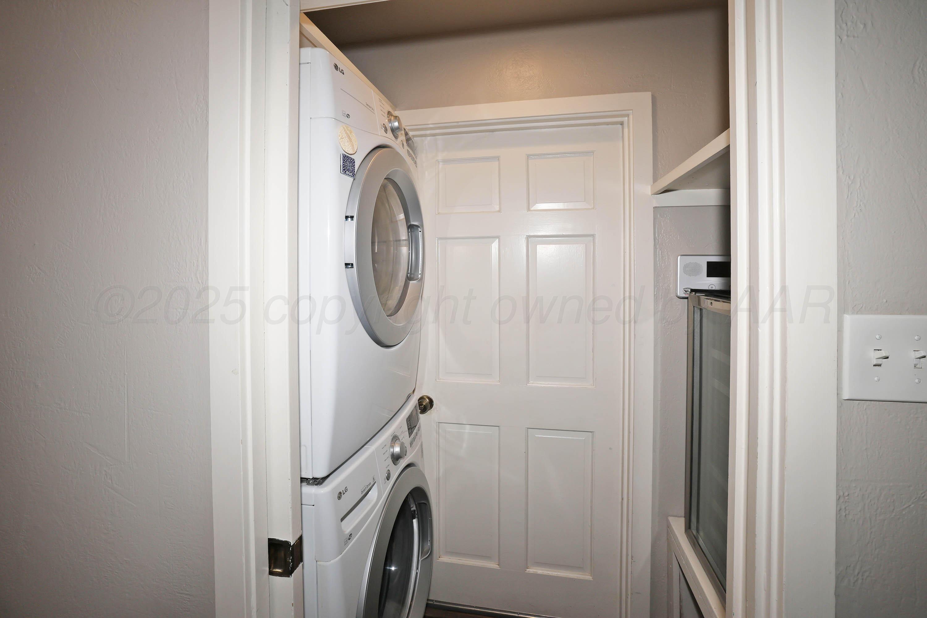 3 Woodstone Street Amarillo, TX 79106 - Photo 20 of 44 a utility room with dryer and washer
