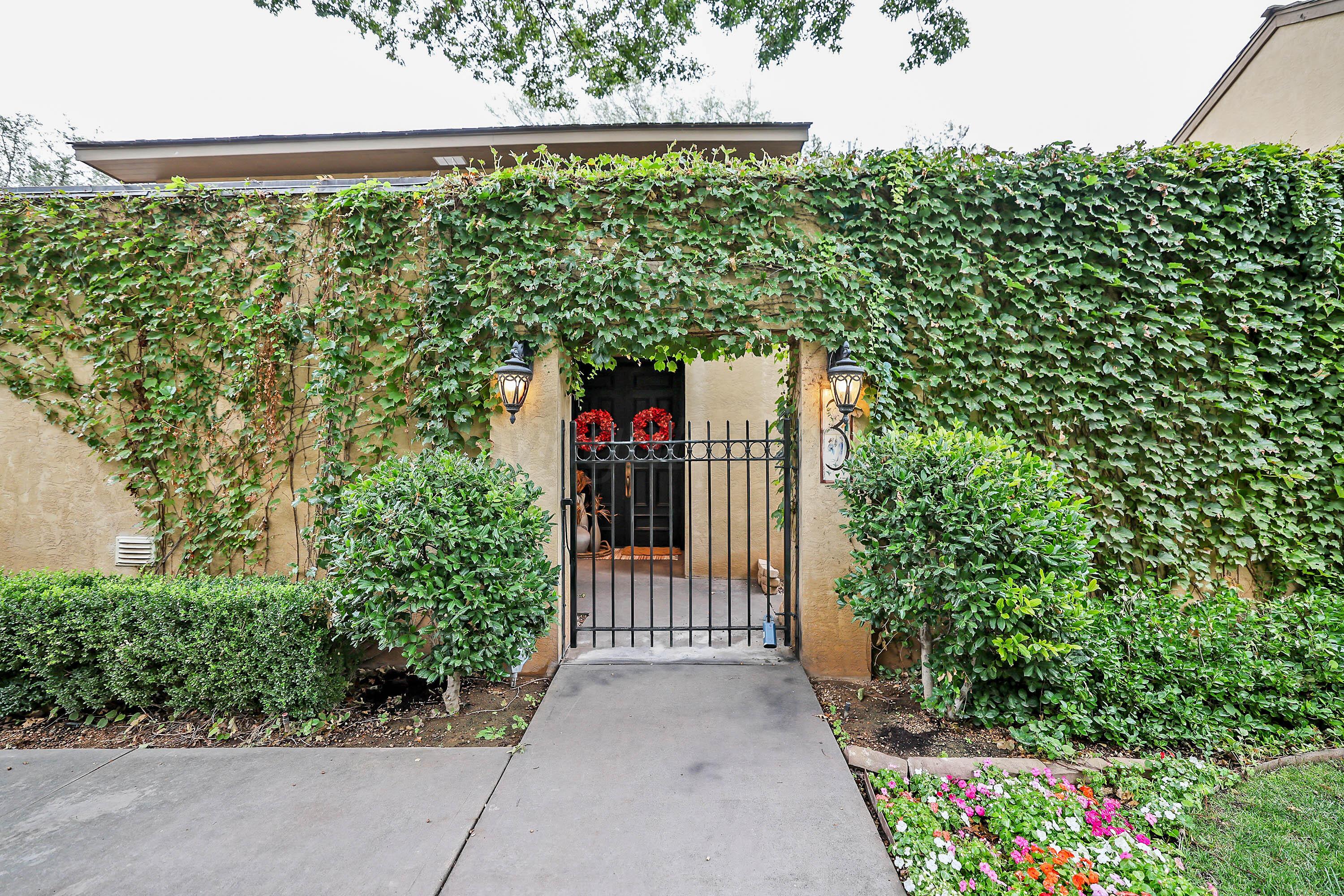3 Woodstone Street Amarillo, TX 79106 - Photo 2 of 44 a view of a garden with wooden fence