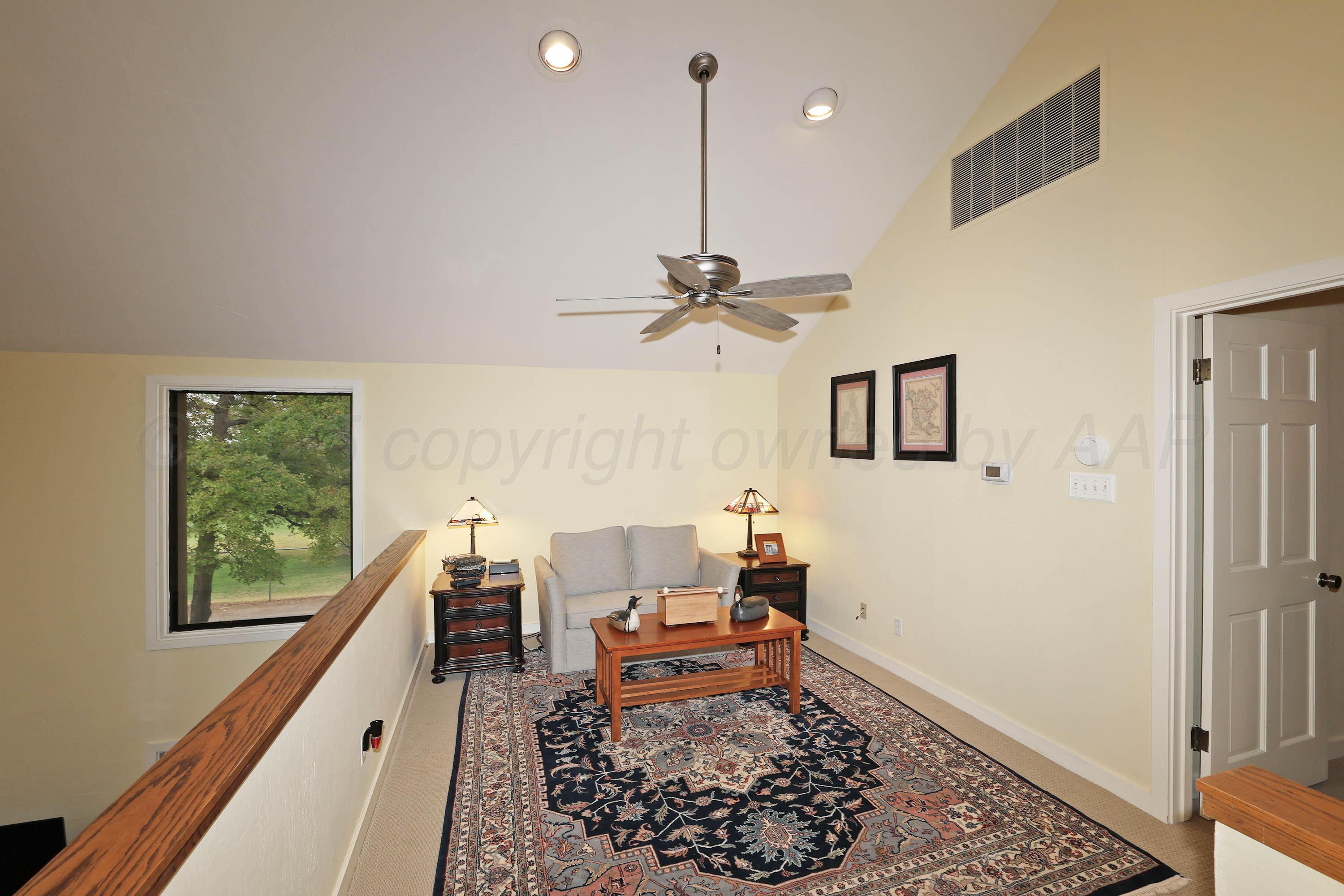 3 Woodstone Street Amarillo, TX 79106 - Photo 30 of 44 a living room with a couch and a rug