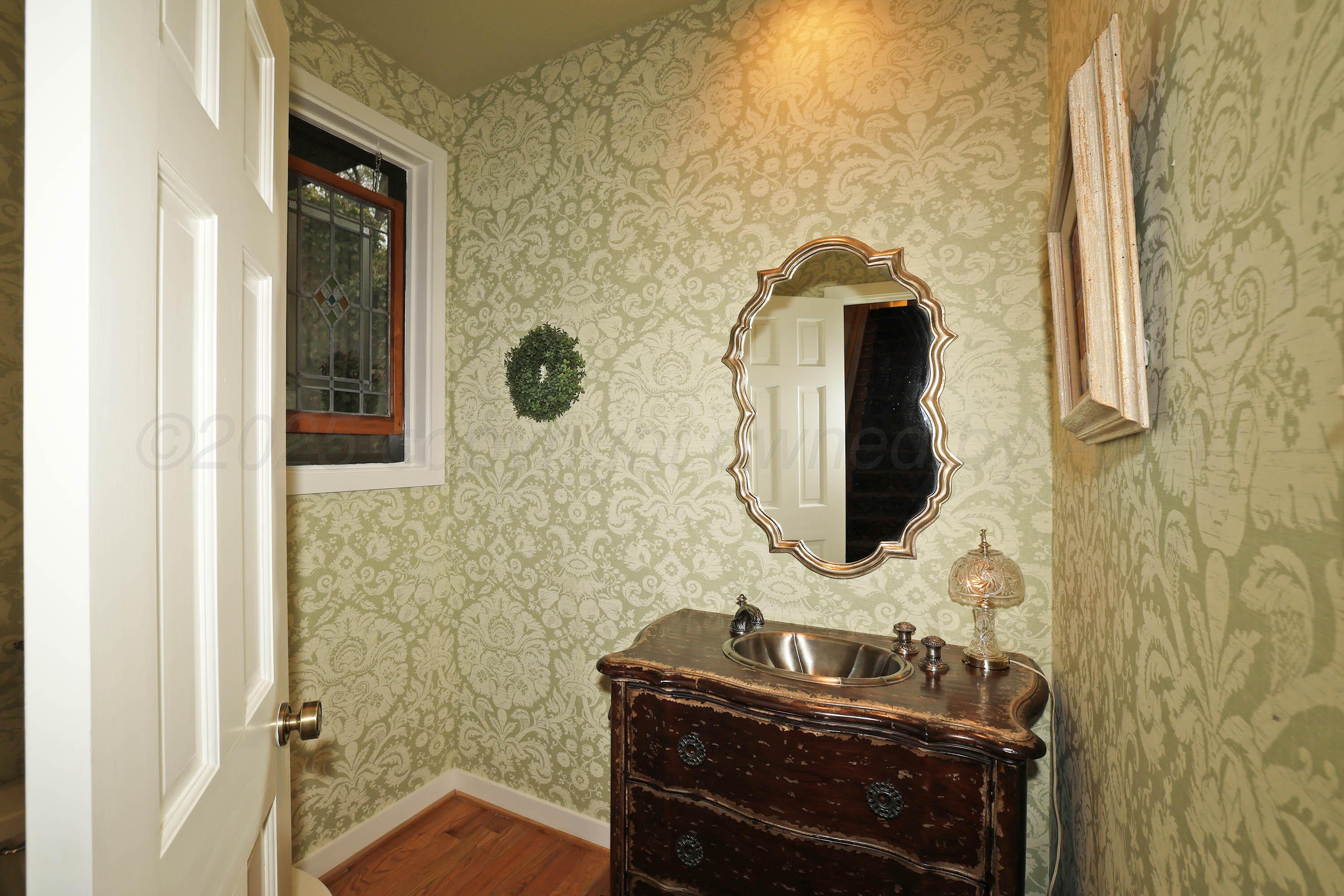 3 Woodstone Street Amarillo, TX 79106 - Photo 10 of 44 a bathroom with a sink and a mirror