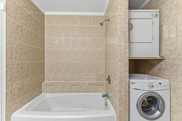 a bathroom with a tub and a shower