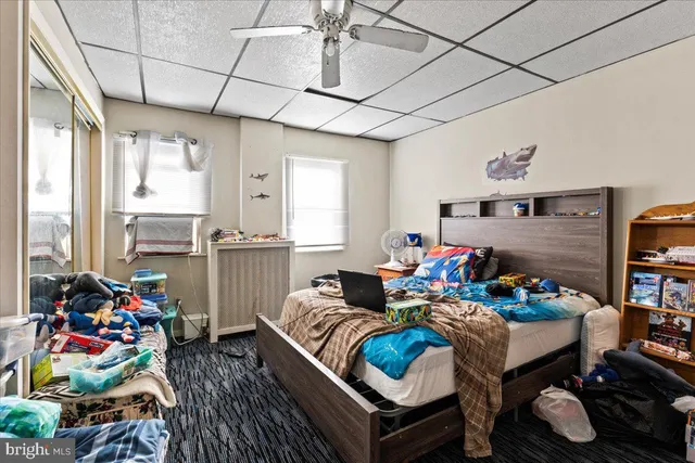 a bedroom with bed and a window