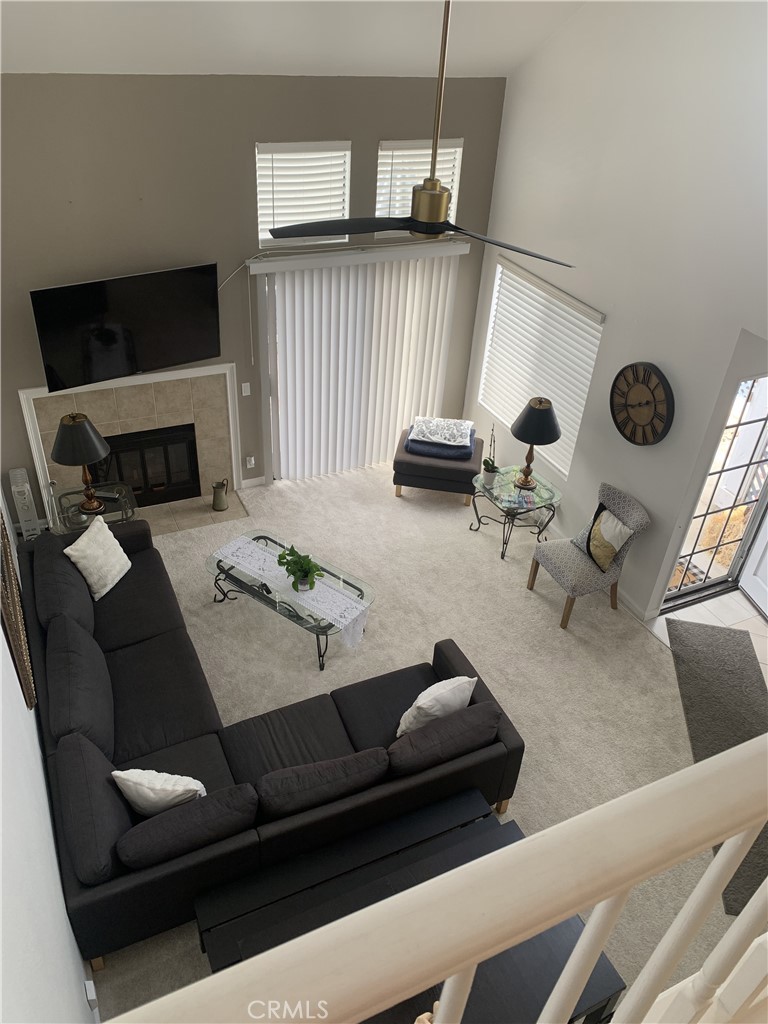 41 Fallingstar, Unit 28 Irvine, CA 92614 - Photo 26 of 34 a living room with furniture and a fireplace