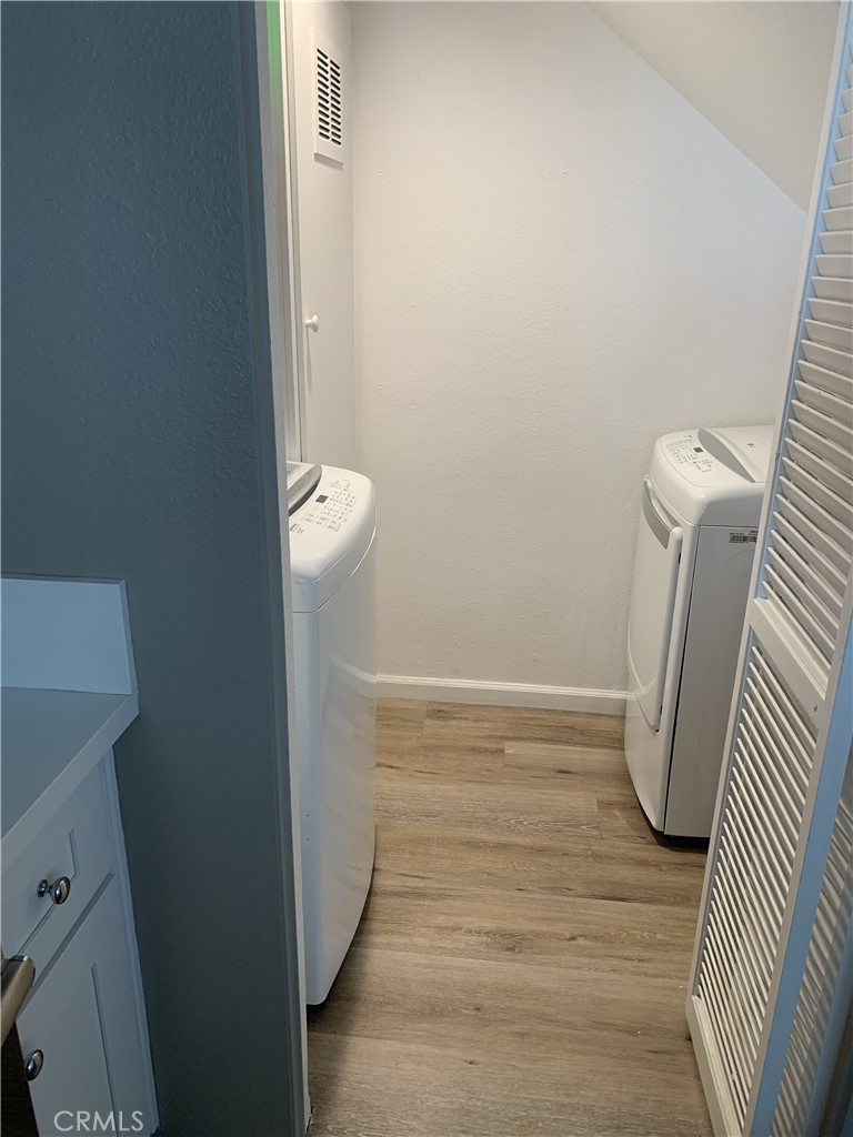 41 Fallingstar, Unit 28 Irvine, CA 92614 - Photo 31 of 34 a view of a room with door and washer
