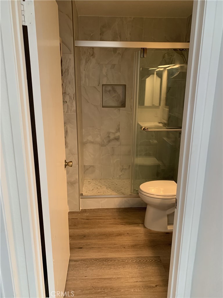 41 Fallingstar, Unit 28 Irvine, CA 92614 - Photo 7 of 34 a bathroom with a toilet and a shower