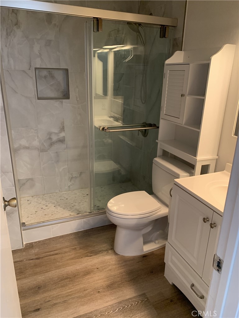 41 Fallingstar, Unit 28 Irvine, CA 92614 - Photo 8 of 34 a white toilet sitting next to a bath tub