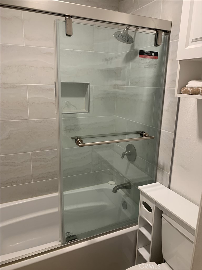 41 Fallingstar, Unit 28 Irvine, CA 92614 - Photo 9 of 34 a bathroom with a shower and a toilet