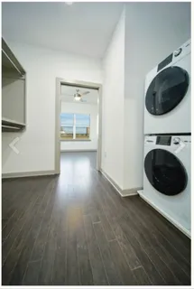 a view of a hallway with washer and dryer