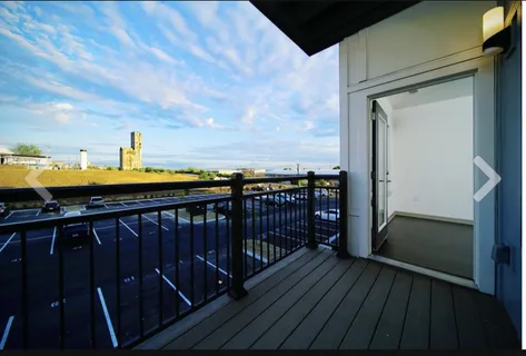 a view of balcony with wooden floor
