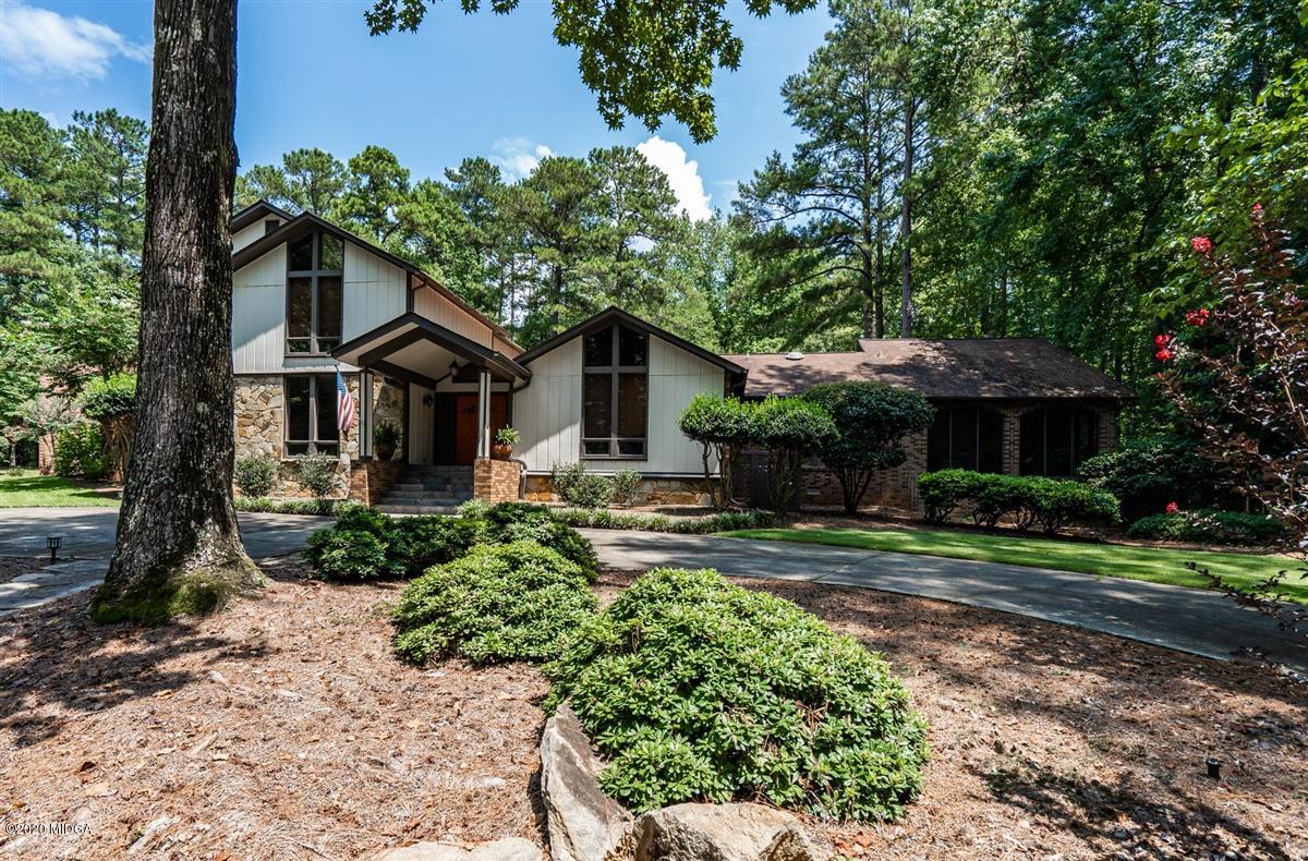 1225 Bass Road Macon, GA 31210 - Photo 1 of 58 a front view of a house with garden