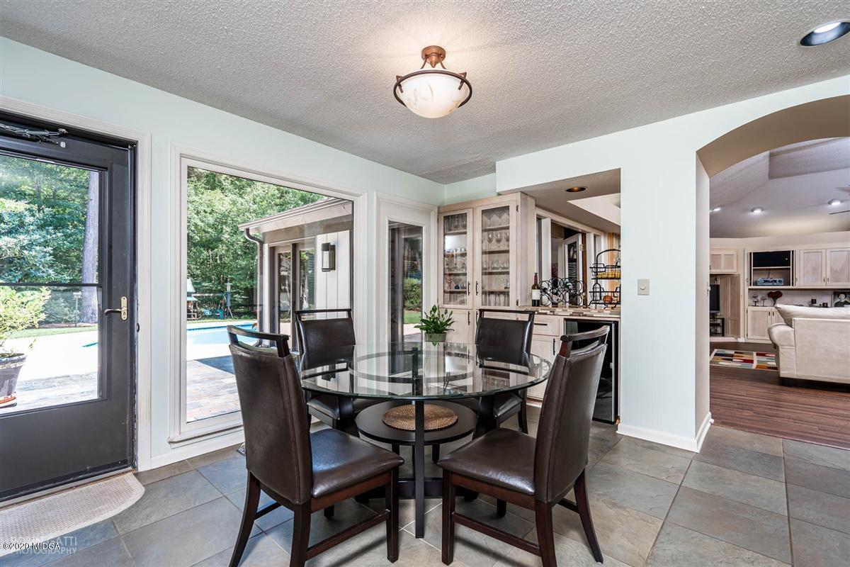 1225 Bass Road Macon, GA 31210 - Photo 14 of 58 a view of a dining room with furniture window and outside view