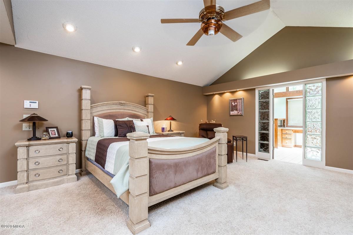 1225 Bass Road Macon, GA 31210 - Photo 20 of 58 a spacious bedroom with a bed and ceiling fan