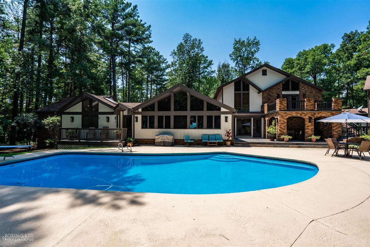 1225 Bass Road Macon, GA 31210 - Photo 3 of 58 a view of a house with swimming pool and sitting area