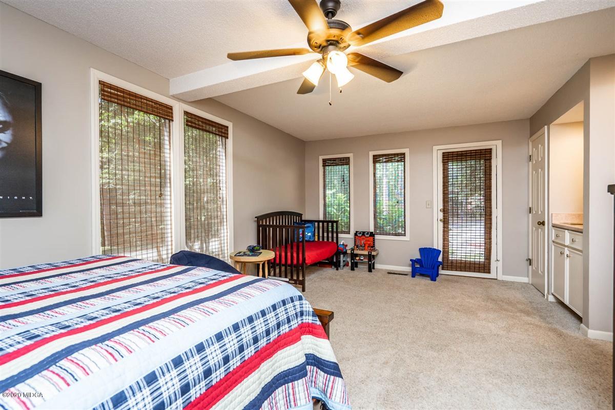1225 Bass Road Macon, GA 31210 - Photo 34 of 58 a bedroom with bed and windows