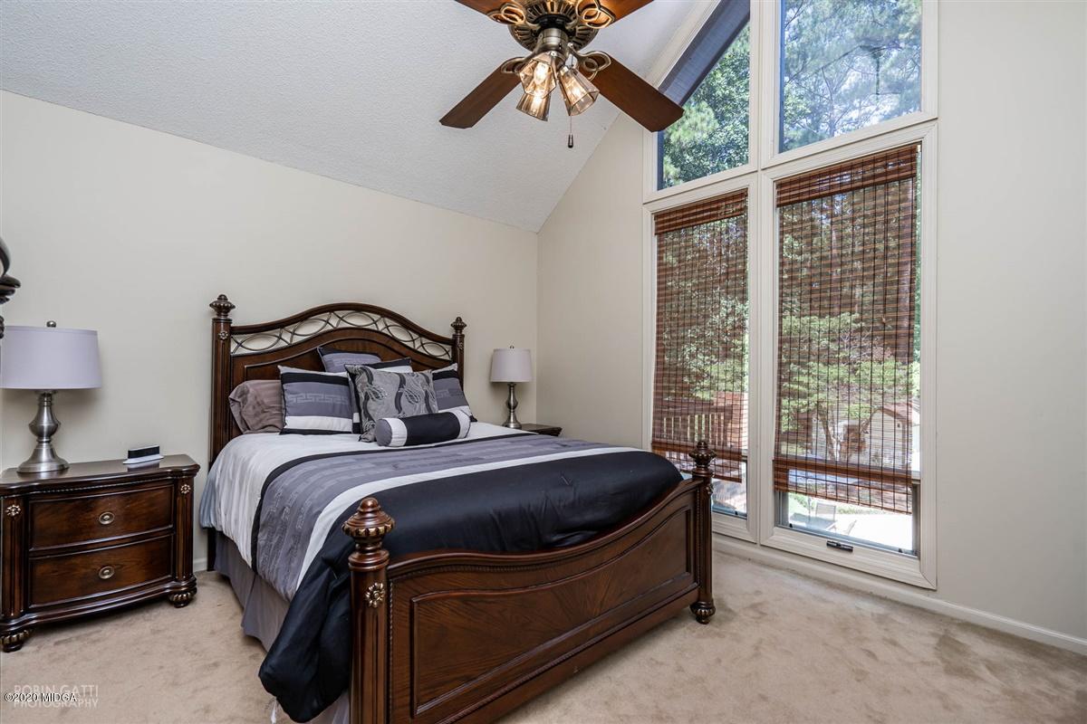 1225 Bass Road Macon, GA 31210 - Photo 45 of 58 a bedroom with a bed and a window