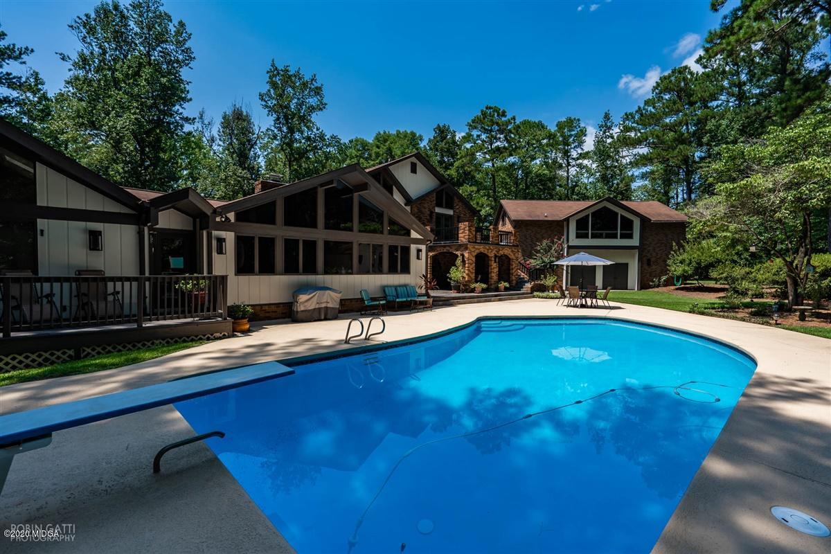 1225 Bass Road Macon, GA 31210 - Photo 46 of 58 a view of a house with pool and chairs