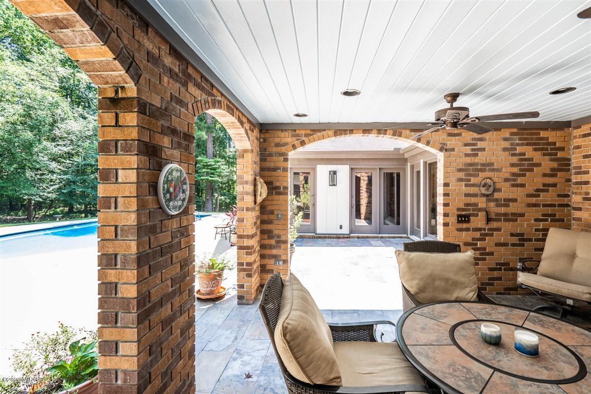 1225 Bass Road Macon, GA 31210 - Photo 47 of 58 a front view of a house with wooden floor and outdoor seating